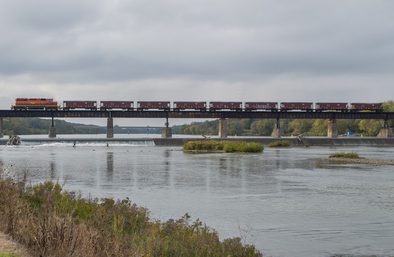 RLHH 3403 leads 9 empty ballast hoppers over the Grand River in Caledonia as train 599.