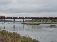 RLHH 3403 leads 9 empty ballast hoppers over the Grand River in Caledonia as train 599.