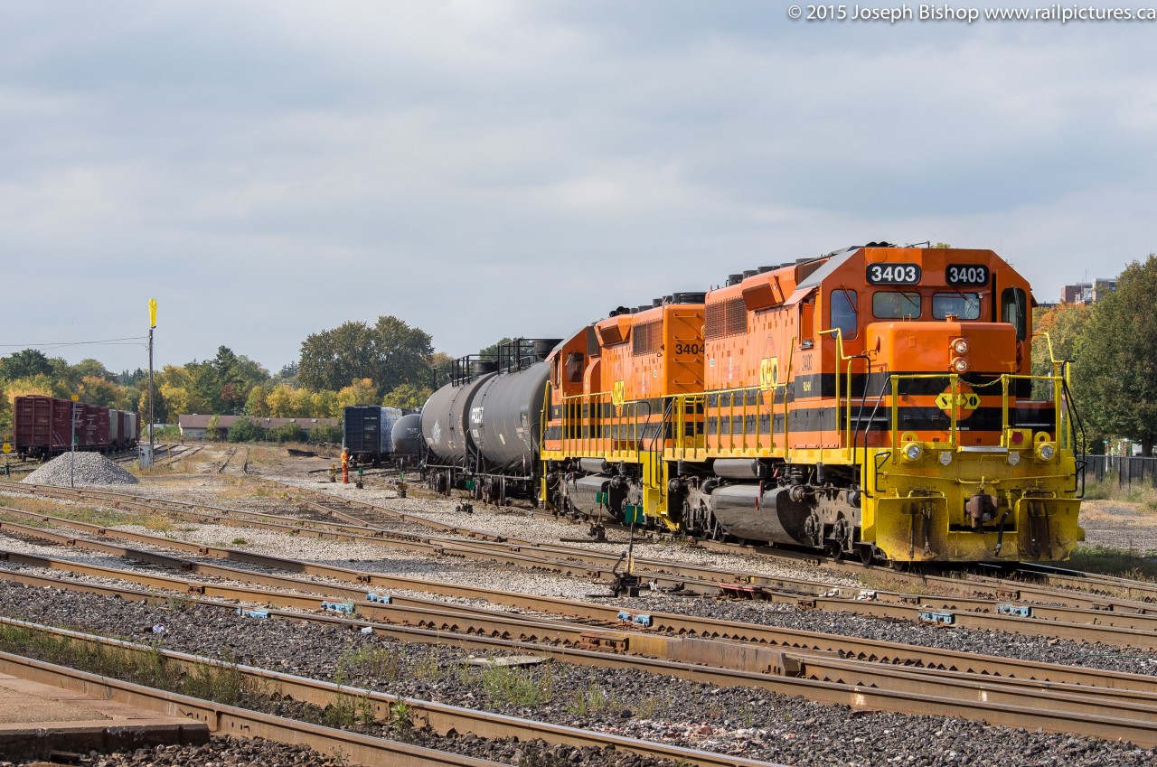 RLHH 3403 and RLHH 3404 pull a cut of tank cars out of the yard at Brantford during a rare daylight run.  They would complete several switching moves before departing with a whopping 3 cars to take back to Nanticoke.