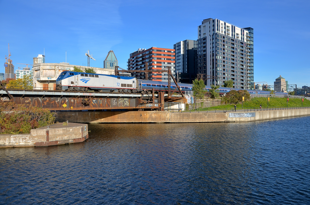 Past Wellington Tower. AMTK 72 pushes the empty Adirondack towards Montreal's Central station about 80 minutes before its 1020 departure, passing Wellington Tower at left in the process.