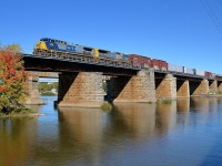 <b>YN2 X 2</b> A matched pair of CSXT YN2-painted engines has become harder to find, but here two of them (CSXT 374 & 7532) lead CN 327 over the Ottawa River as they leave Montreal.