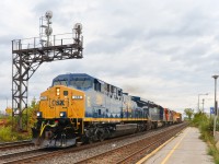 <b>CSXT's Chessie unit in Montreal.</b> Fresh out of the paint booth, CSXT 366 (with 'Chessie System' decal applied on the nose) leads CN 327 through Dorval. Trailing are two veteran EMD units (ex-BN SD40-2 HLCX 7187 and GP38-2 CN 4703).
