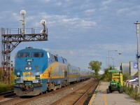 <b>VIA 59 passing a baggage cart.</b> VIA 59 passes a baggage cart which will be used to unload baggage from VIA 64, which will arrive momentarily.