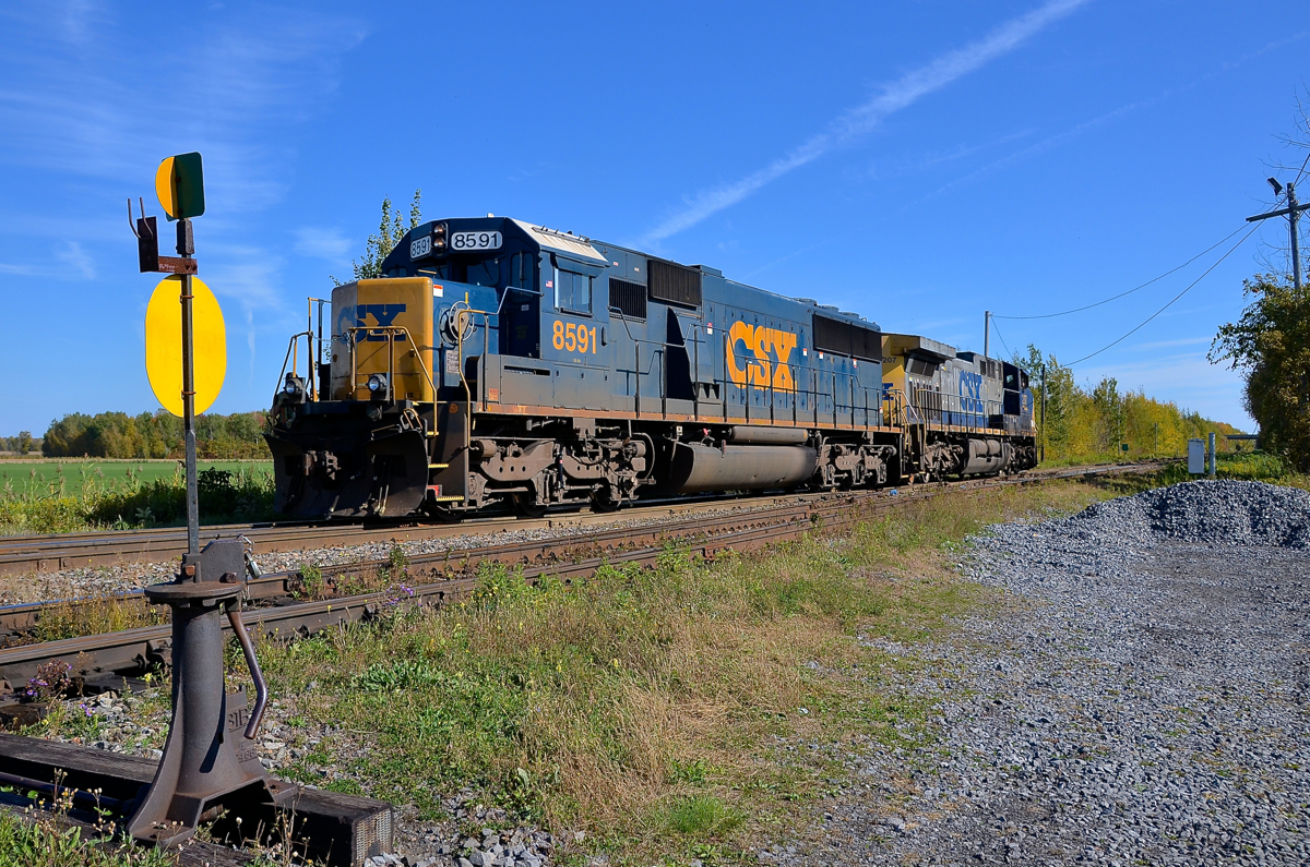 A 31 year old EMD backing up. SD50-2 CSXT 8591 (built as BO 8591 in 1984) back up to CN 327's train after setting off cars on the Valleyfield sub in Coteau with the help of CN 538. When the train departs AC4400CW CSXT 207 will lead.