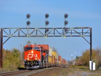 <b>Passing the Valleyfield sub turnout.</b> An extremely late CN 149 is through Coteau with brand new CN 3015 leading. At right is the Valleyfield sub, which CN 327 had taken about an hour before to do a setoff before heading towards Huntingdon.