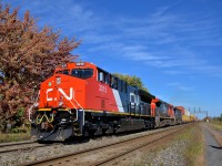 <b>A fresh GE leading two older Dash9's.</b> An extremely late CN 149 is through Coteau with brand new CN 3015 leading older Dash9-44CW's CN 2566 & BCOL 4651.