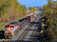 <b>BC Rail Cowl & a GP9.</b> CN 527 has BCOL 4625 & CN 7083 as it approaches Taschereau Yard.