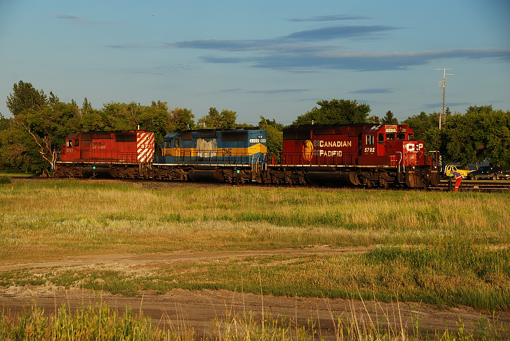 A trio of SD 40-2's including DME 6359 The Mount Rushmore Unit have cut off their ballast train and are heading for the shops tracks