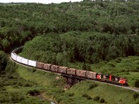 Eastbound mixed freight on CN's Prairie North Line crosses Boggy Creek near the Saskatchewan Border 