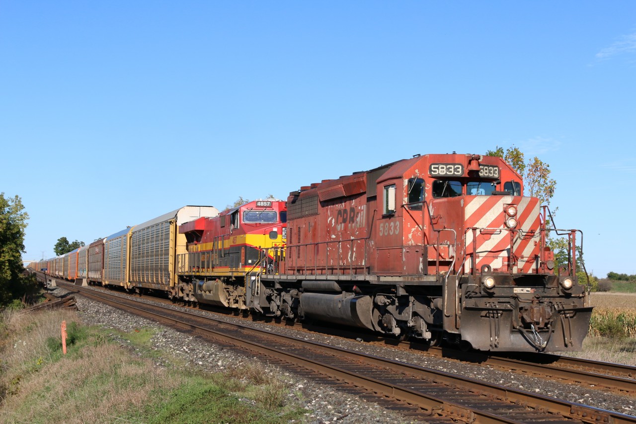 CP 147 with a venerable SD40 and a KCS Gevo are getting their train back up to track speed after a stop at Hornby yard.
