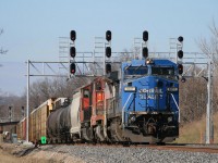 CN 394 didn't disappoint this day......NS(Conrail)C40/ BNSF(Santa Fe)B40 and a CN SD70 as it heads east under signal 361T3 at Snake.....Note on track 2 a WB yellow signal and a restricting signal on the Aldershot yard lead.