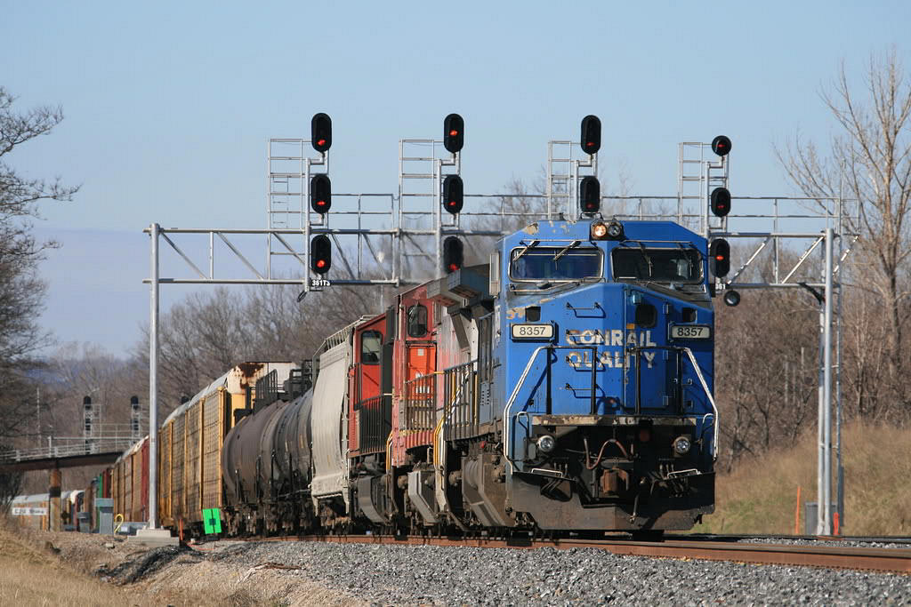 CN 394 didn't disappoint this day......NS(Conrail)C40/ BNSF(Santa Fe)B40 and a CN SD70 as it heads east under signal 361T3 at Snake.....Note on track 2 a WB yellow signal and a restricting signal on the Aldershot yard lead.