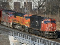 CN 393 was always a candidate for some foreign power.....CN 5651 / BNSF 917 / BNSF/ATSF 151 elephant style passing Lemmonville Rd bridge late afternoon. That ATSF 151 is a long way from it's premier assignments years ago on the Z-199 hotshot between Chicago and San Francisco.