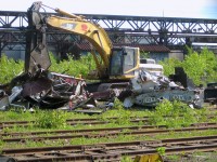 <b>End of the line for an underused electric engine.</b> A GE E60C-2 that was built for Nacionales de México during the 1980's is being scrapped on the Dominion Bridge property in the spring of 2008. My future father-in-law (Glen Fisher) was involved in brokering these locomotives and attempting to sell/lease them to Montreal's AMT (commuter train agency) for use on the electrified Deux-Montagnes line. The AMT did not decide to use them and all were scrapped.