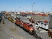 <b>What was taken for granted.</b> CP GP9's were plentiful in Montreal (and elsewhere) when this picture was taken in 2009, so it was easy to take them for granted, though they are missed now. Here CP 1697 & CP 8228 work the Lachine IMS yard. CP 1697 was retired in 2011 and CP 8228 in 2013.