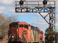 331 slowly passing under the signals as it enters the station.