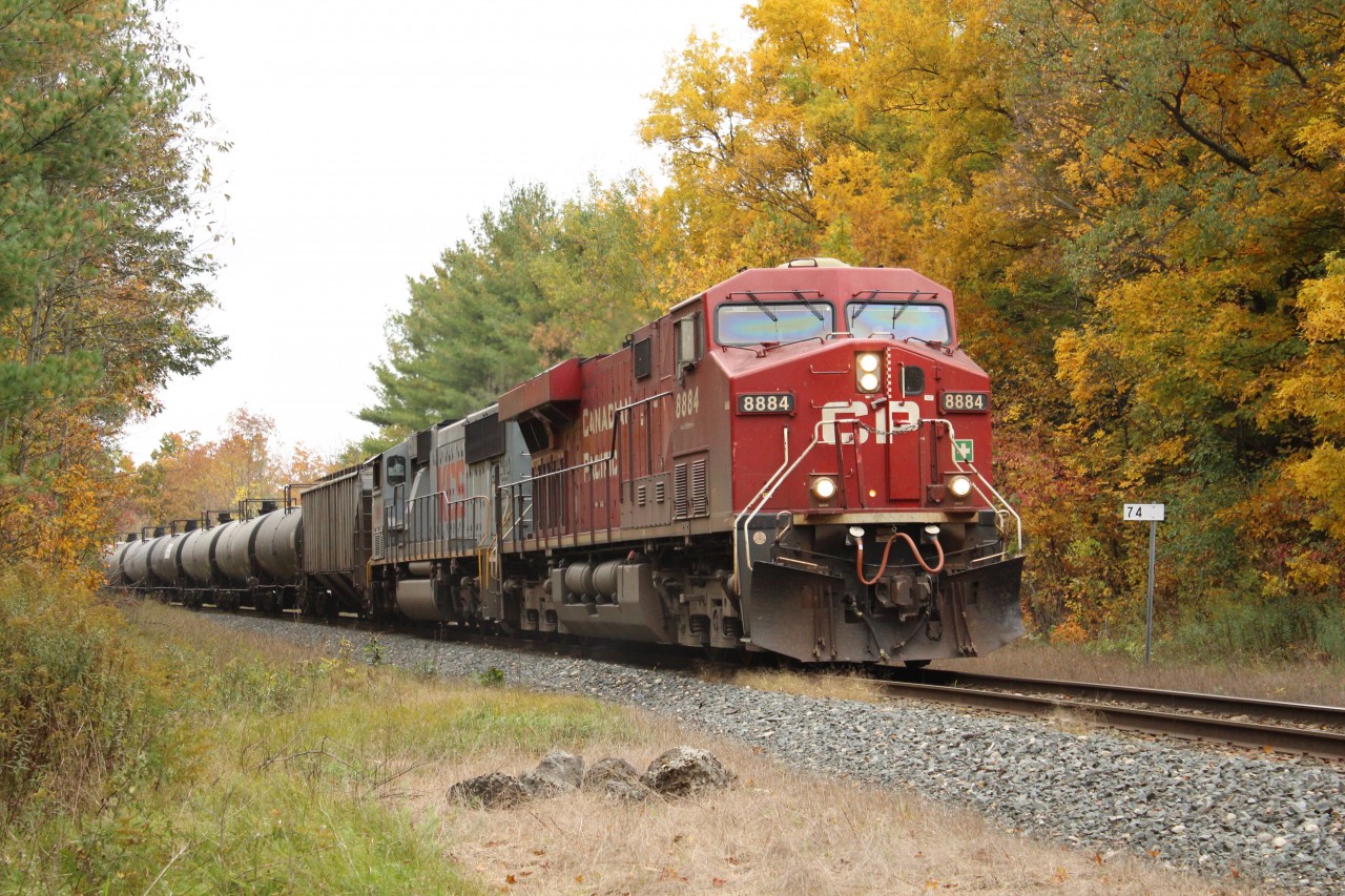 CP 8884 is leading Kansas City Southern 3916 down the Hamilton sub and around the bend past MM74 with its manifest of ethanol tankers after waiting for CP 9528 to clear upwards and in to Guelph Junction.