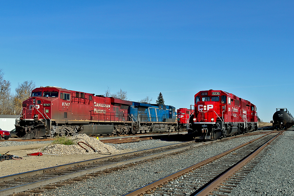 Road power waiting for their next turn of duty;  ES44AC CP 8747, AC4400CW CEFX 1043 and GP38-2 CP 7308, while on the near track, what seem to have become "resident" yard switchers GP20C-ECO CP 2235 and 2327.  (see also photo 18899)