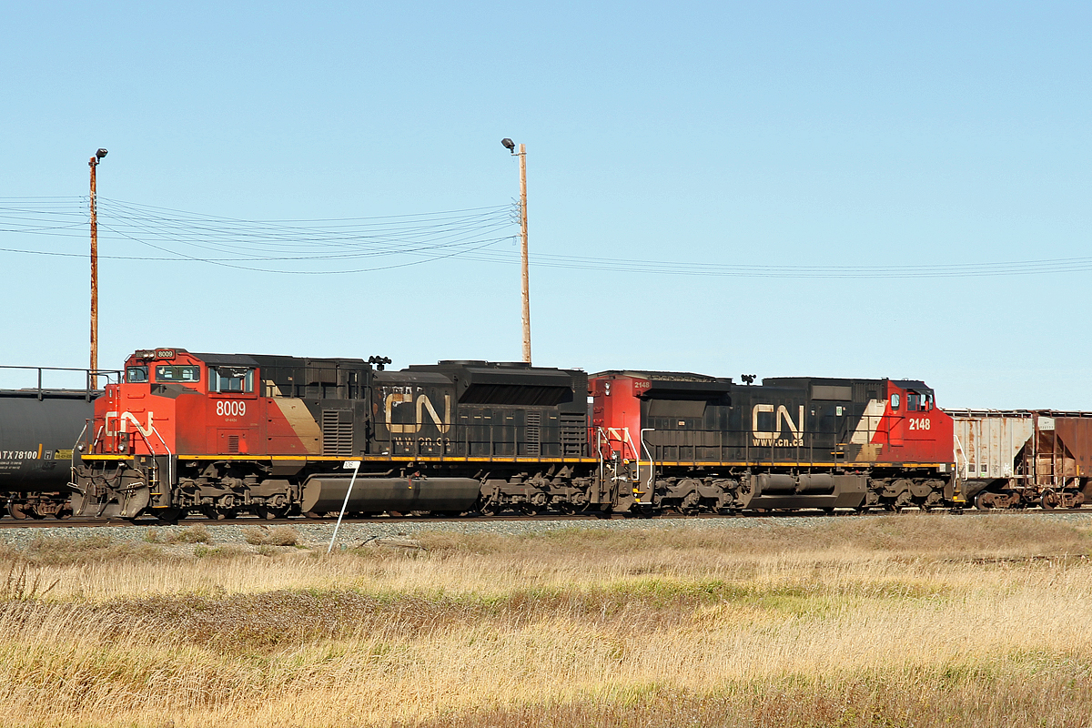 Just hangin' around.  There was lots of activity in Scotford yard but these two were just sitting idle at the east end.  SD70M-2 CN 8009 and DASH8-40CW CN 2148 (ex BNSF)