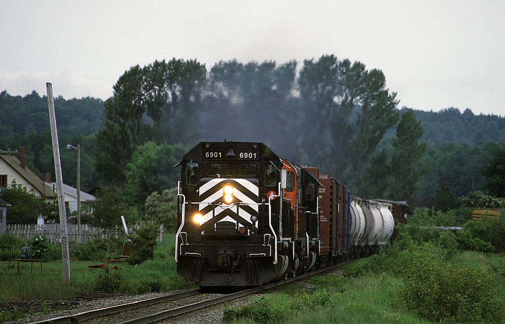 New Brunswick East Coast SD40 6901 leads train #402 (Campbellton - Miramachi) through Nash Creek. This train left Campbellton around 0700 and required a spirited chase along parallel Highway 11.
