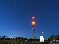 It's a beautiful starry night north of the city, a restricting signal is displayed on the home signal at Pine Orchard as CN 451 takes the siding for a heavy southbound CN 318.