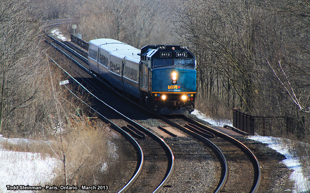 Out for a country stroll!  VIA 6415 leads it's train as it has crossed the mighty Grand River, and is about to cross the appropriately named Grand River Street North overpass as it winds it's way through Paris.