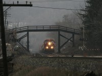 A very mild January winter day..has set the mood here..most snow has melted and everything is brown plus low cloud cover is hanging over....CP 159 hustles the usually moderate 6000 foot train up the hill through the wooden bridge.