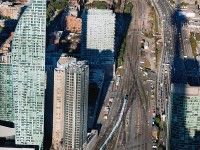 Way, way up in the CN Tower we look down to see the half hour westbound go train approaching Union Station on track three. 