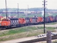 A lashup to dream of. 318 did work everywhere, so the SW1200's probably ended up there. But mixing an SD40-2 (which was rare in Toronto in those days) with 2 RS18's and a GP9 was pretty special. I wonder how it sounded on the Kingston Sub?