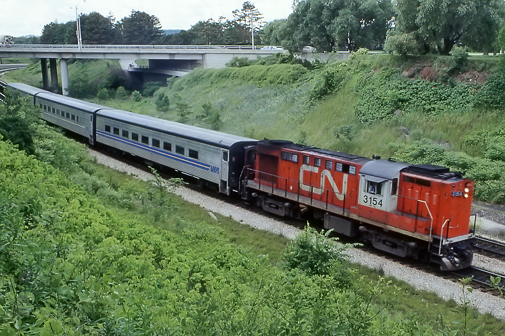 3 Tempo coaches trail high speed RS18 3154 heading back to Toronto from Sarnia.