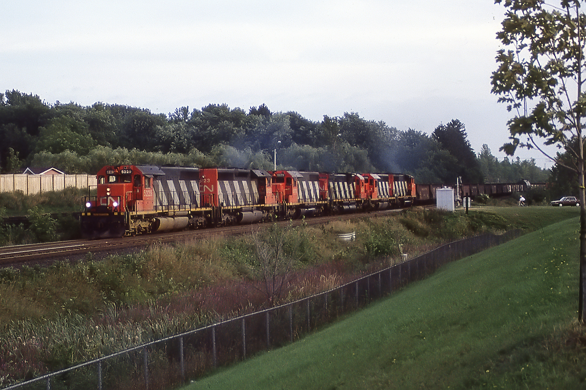 309 was a "leftovers" train for Winnipeg, that often had a lot of extra power. 4 SD40's, an M630 and a GP40-2 drag this huge subdivision clogging (now called over siding) up the escarpment into Richmond Hill