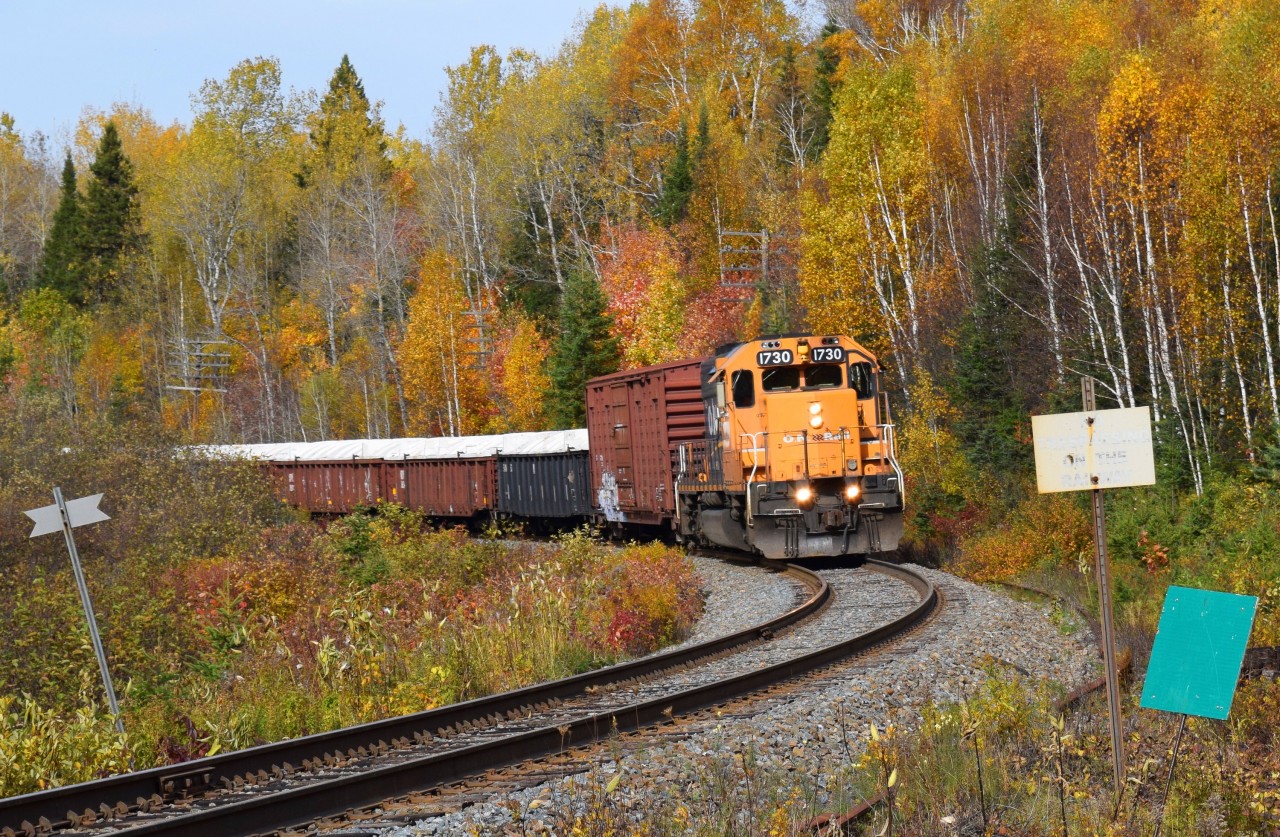 ONT 1730 south rounds the corner at mile 11.7 of the Temagami sub with a short train of mixed goods on a beautiful October afternoon.