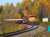 ONT 1730 south rounds the corner at mile 11.7 of the Temagami sub with a short train of mixed goods on a beautiful October afternoon.