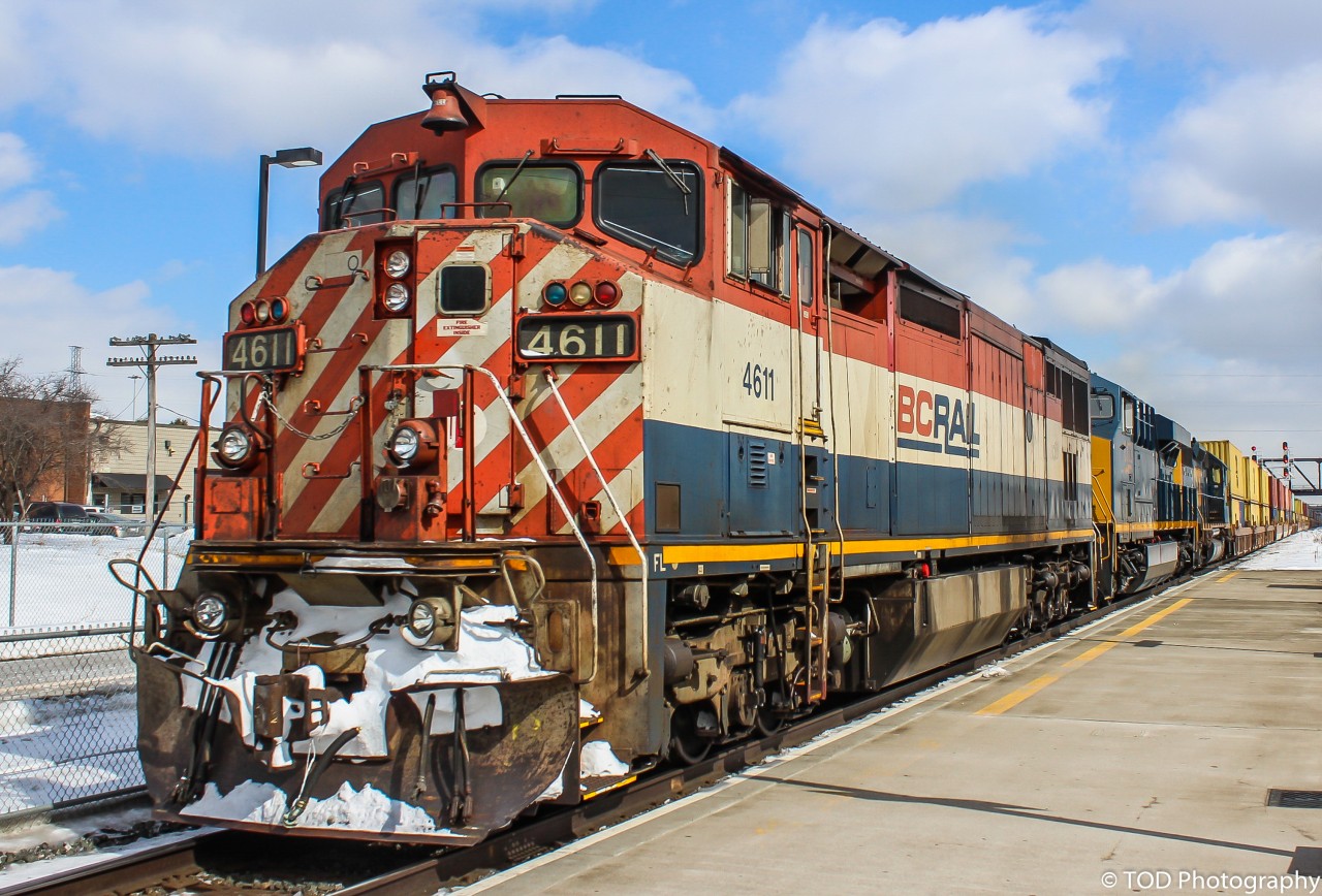The daily Montreal-Chicago Intermodal train comes through Oshawa VIA station, back in March 2015, with a BC Rail Dash 8, and a pair of CSX units. 

BCOL 4611, CSX 3172, CSX 8406