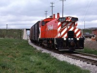 On yet another overcast day in May of 1980, CP's switch job on the Waterloo Sub runs south, passing under CN's Guelph Sub.
CP would switch the Seagrams Distillery and a very small yard just to the NW of the distillery. I only rarely saw this operation - not having the patience to wait around, and radio or access inside information. It wasn't until I saw the photos by Greg MacDonnell in one of his books that I realized what an idiot that I was.
CN had a spur that ran up to Elmira. I walked over that track almost daily and I never photographed that operation - dumbass that I am.