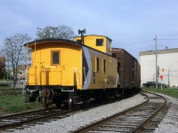 The rear end of the CP switch job at the end of the Waterloo Sub. 
Traffic is stopped at Erb Street (on the right) and Caroline (on the left).
The tall building on the right is part of Seagrams Distillery.
CN's track to St Jacobs and Elimra is on the left.
