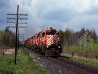 My brother and I biked down to Ayr from our home in NW Waterloo to watch the CPR. We spend virtually the entire day trackside and this is the second of two trains that we saw. The sun cooperated for me however.
It is westbound at Cedar Creek Road.
I would rather have a MLW unit leading but a full-faced-narrow-striped SD-40 has its charms.
We would continue our circuit into Galt where we would encounter some foul weather. It would be well after sunset by the time we would arrive home. 
