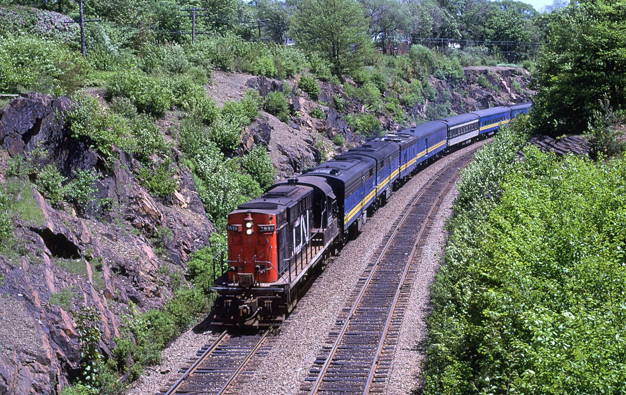 VIA was running two trains a day to Montreal back in 1980. Here, the "Ocean" is at Prince Arthur St, shortly after beginning the journey to Montreal.
There were many times when the lead FPA-4 was replaced by a leased CN RS-18 - a big disappointment to this photographer at the time. Even though I have been to Halifax in recent times, I don't bother to railfan the area. It is just not that interesting any more. This scene has changed quite a bit. Vegetation has encroached significantly and there is only one track, if Google street view is to be believed.