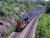 VIA was running two trains a day to Montreal back in 1980. Here, the "Ocean" is at Prince Arthur St, shortly after beginning the journey to Montreal.
There were many times when the lead FPA-4 was replaced by a leased CN RS-18 - a big disappointment to this photographer at the time. Even though I have been to Halifax in recent times, I don't bother to railfan the area. It is just not that interesting any more. This scene has changed quite a bit. Vegetation has encroached significantly and there is only one track, if Google street view is to be believed.