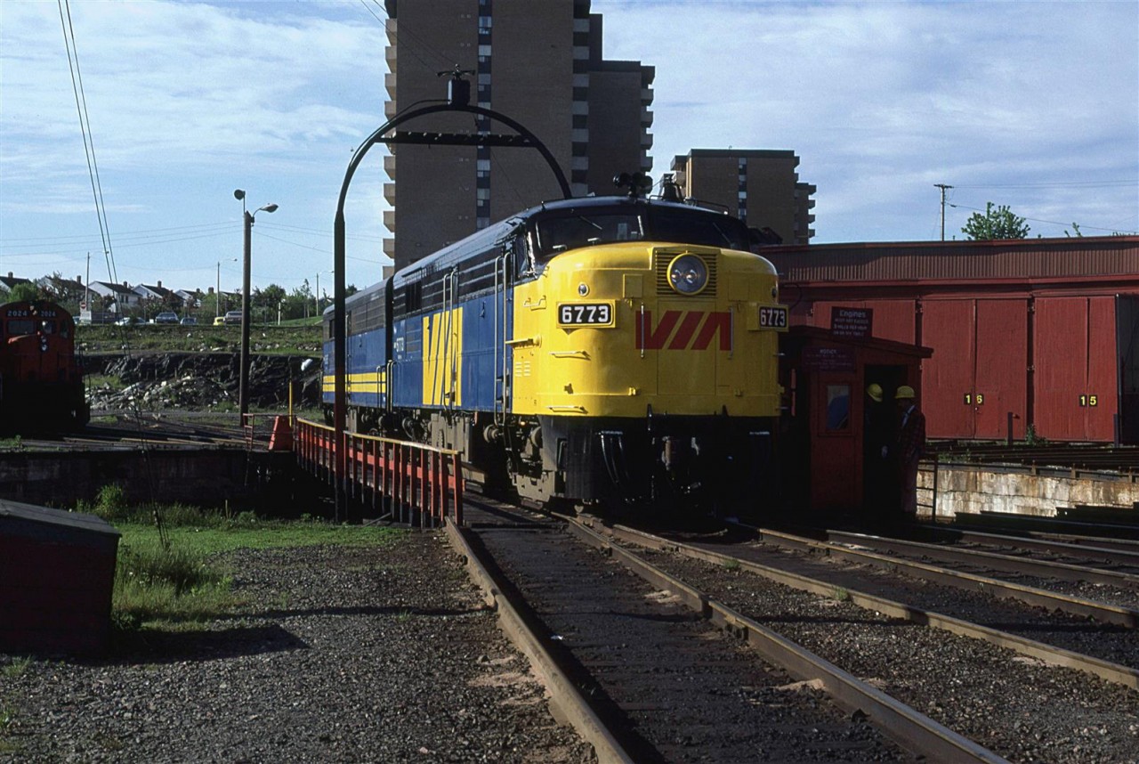 VIA 6773 rides the turntable after being serviced in the roundhouse at Fairview Shops.
The view from that apartment building in the background must have been tremendous to a certain portion of the population.