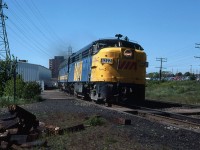 VIA's eastbound Atlantic is only a few minutes from the Halifax Terminal.
It is at Armdale, a flag stop for local VIA trains. 
Note the CPR boxcars at far right. These are at the Simpson-Sears warehouse and store. Shoppers from around Nova Scotia could come into town on the RDC's, walk to Simpson-Sears and the adjacent Halifax Shopping Center, then catch a return train home.