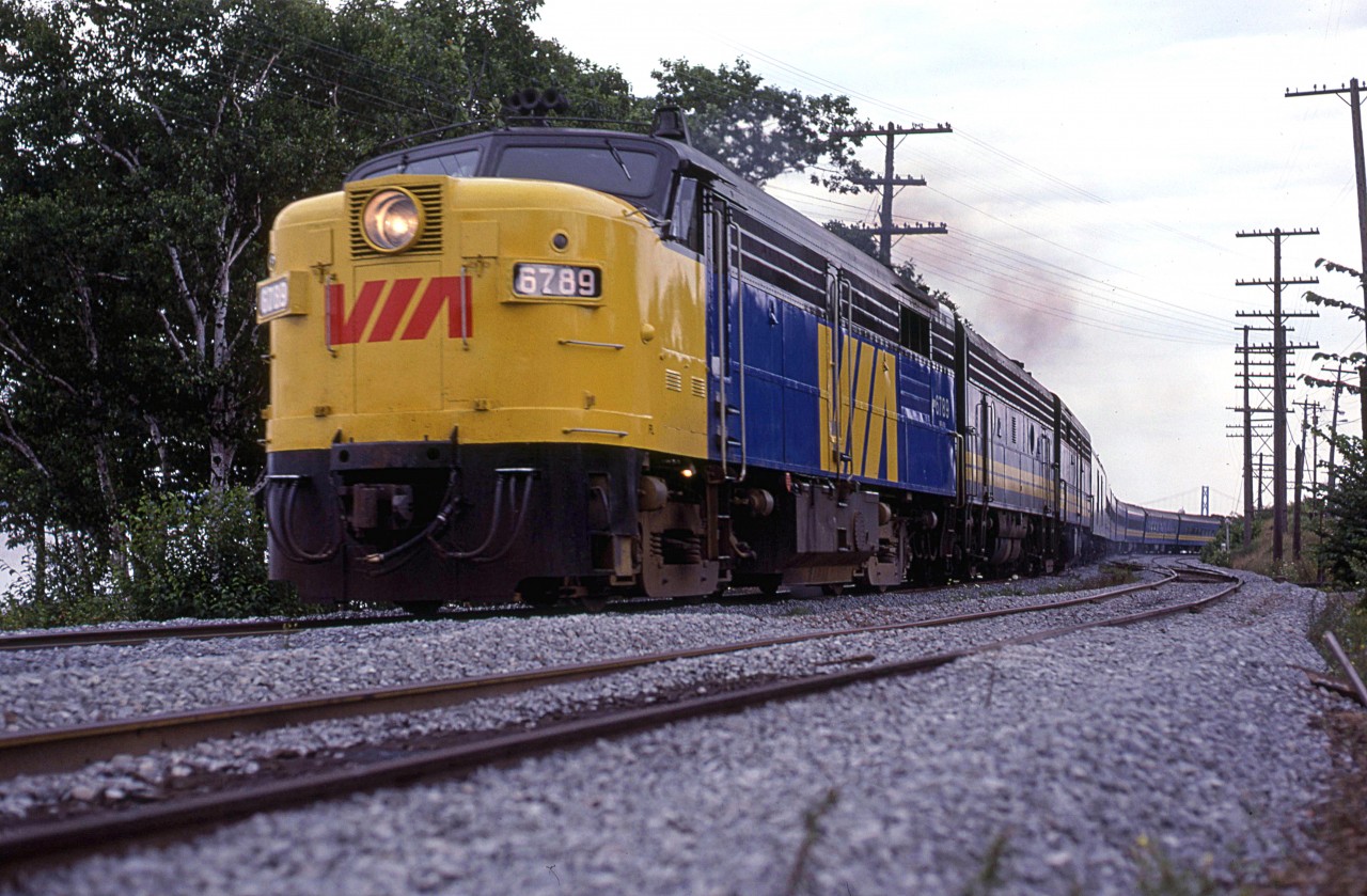 VIA's westbound "Ocean" has just left Rockingham and rounded Sherwood Point with what looks like a freshly painted FPA-4 leading. Just ahead is Birch Cove.
The new bridge over the harbour (MacKay Bridge) can be seen in the background