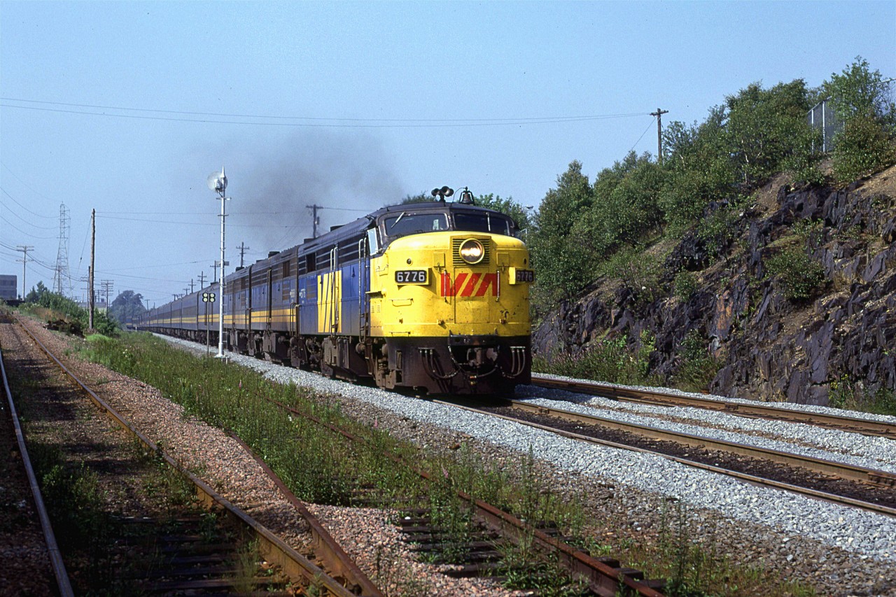 The eastbound Atlantic is passing Southwestern Junction (the steep branch to the left is beginning of the Chester Sub) as it enters the Halifax peninsula. The Fairview roundhouse backs up the the track on the opposite side of the train about where the baggage car is.