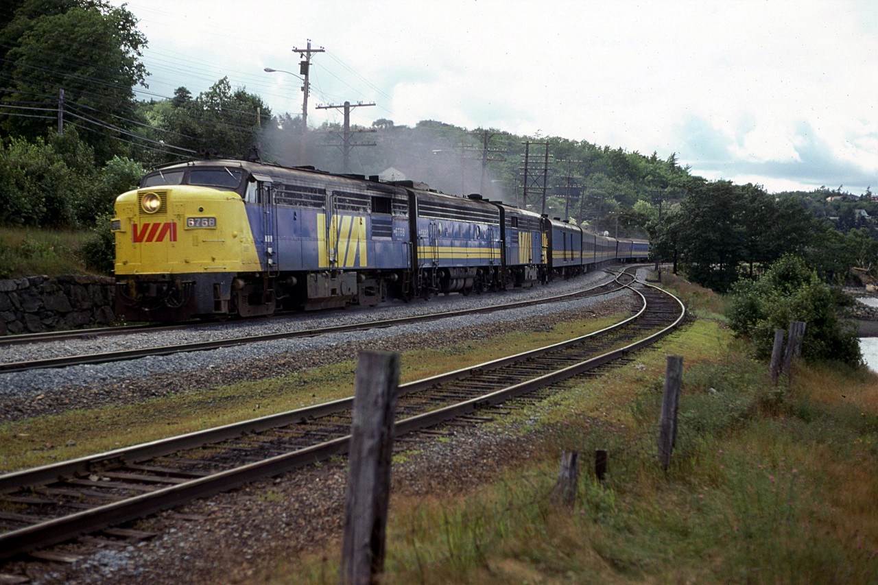 The eastbound "Atlantic" is beginning to round Sherwood Point, just north of Rockingham along the Bedford Basin.
The track on the right and the switches are the beginning of Rockingham yard.
Birch Cove is at far right.