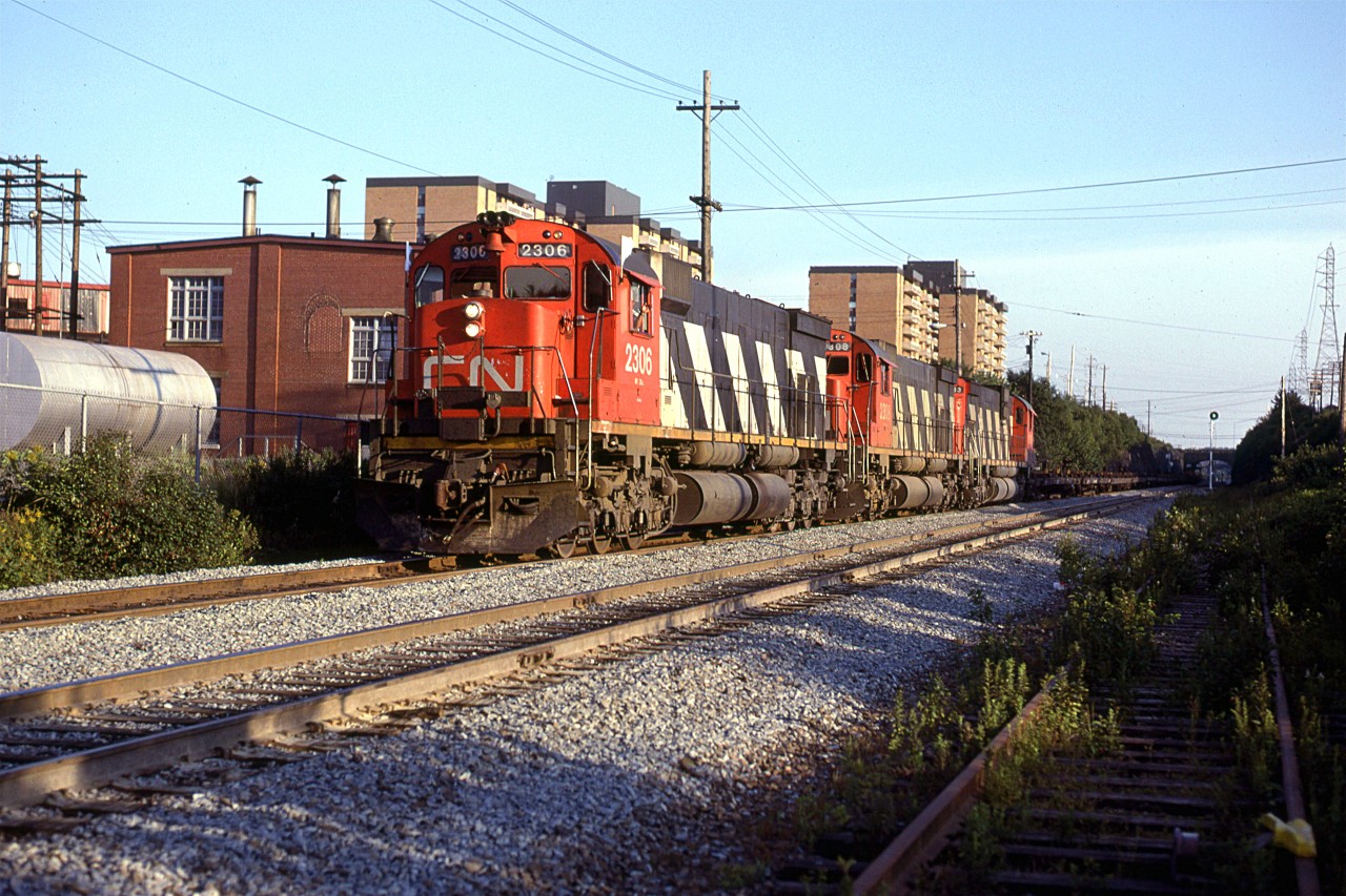 This is probably CN #205 with the cut of cars from Halifax Intermodal Terminals (Downtown). Shortly, it will stop at Rockingham yard and collect more cars, before heading out to Montreal.
It is passing Fairview Shops.