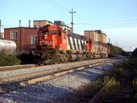 This is probably CN #205 with the cut of cars from Halifax Intermodal Terminals (Downtown). Shortly, it will stop at Rockingham yard and collect more cars, before heading out to Montreal.
It is passing Fairview Shops.