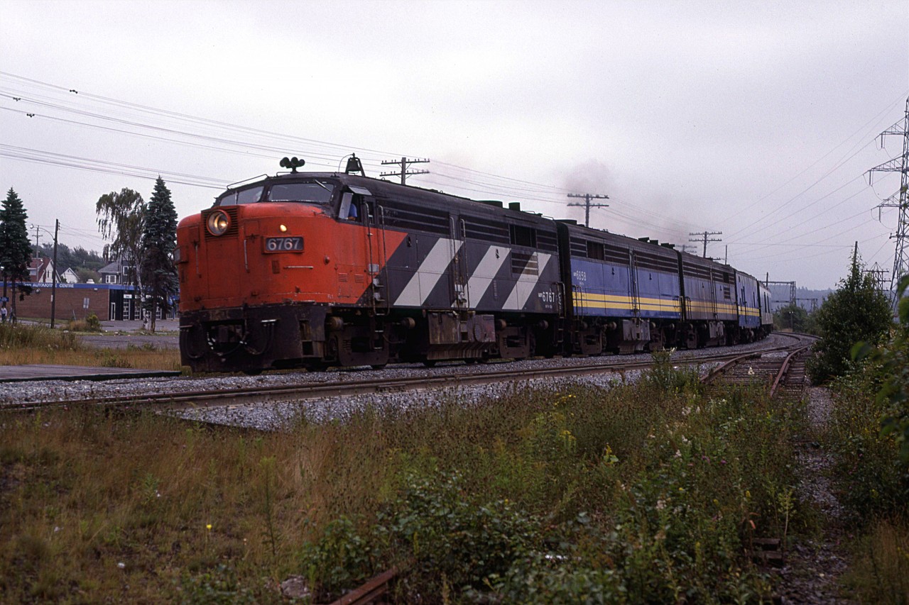 On an overcast Sept 1st of 1980, the "Ocean" is lead by one of the (Perhaps, the only?) remaining FPA-4's still in CN colours.
The Armdale platform may be seen at left. The super-elevation of the tracks is less obvious, though.