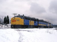 On the day before Christmas, the weatbound "Atlantic" glides by Armdale as it exits Halifax.
The middle "B" unit is an EMD product.
Note the large piles of snow in the background and that the platforms for the Armdale whistle stop "station" are cleared.