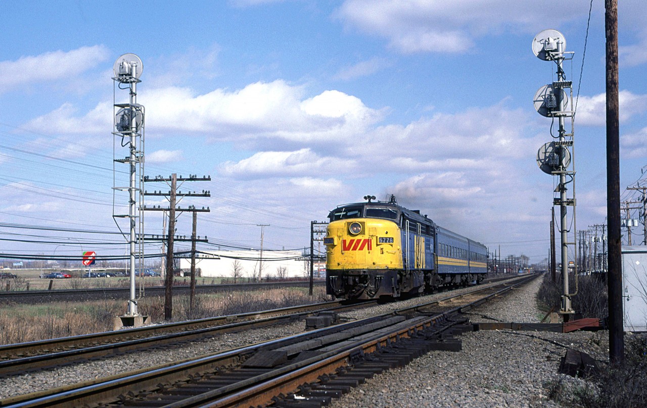 A short westbound VIA train splits the signal at Dorval crossovers.
The VIA station may be seen at far right, and does anyone remember Tilden Rent-a-car? It probably went the same way as Rent-a-wreck.