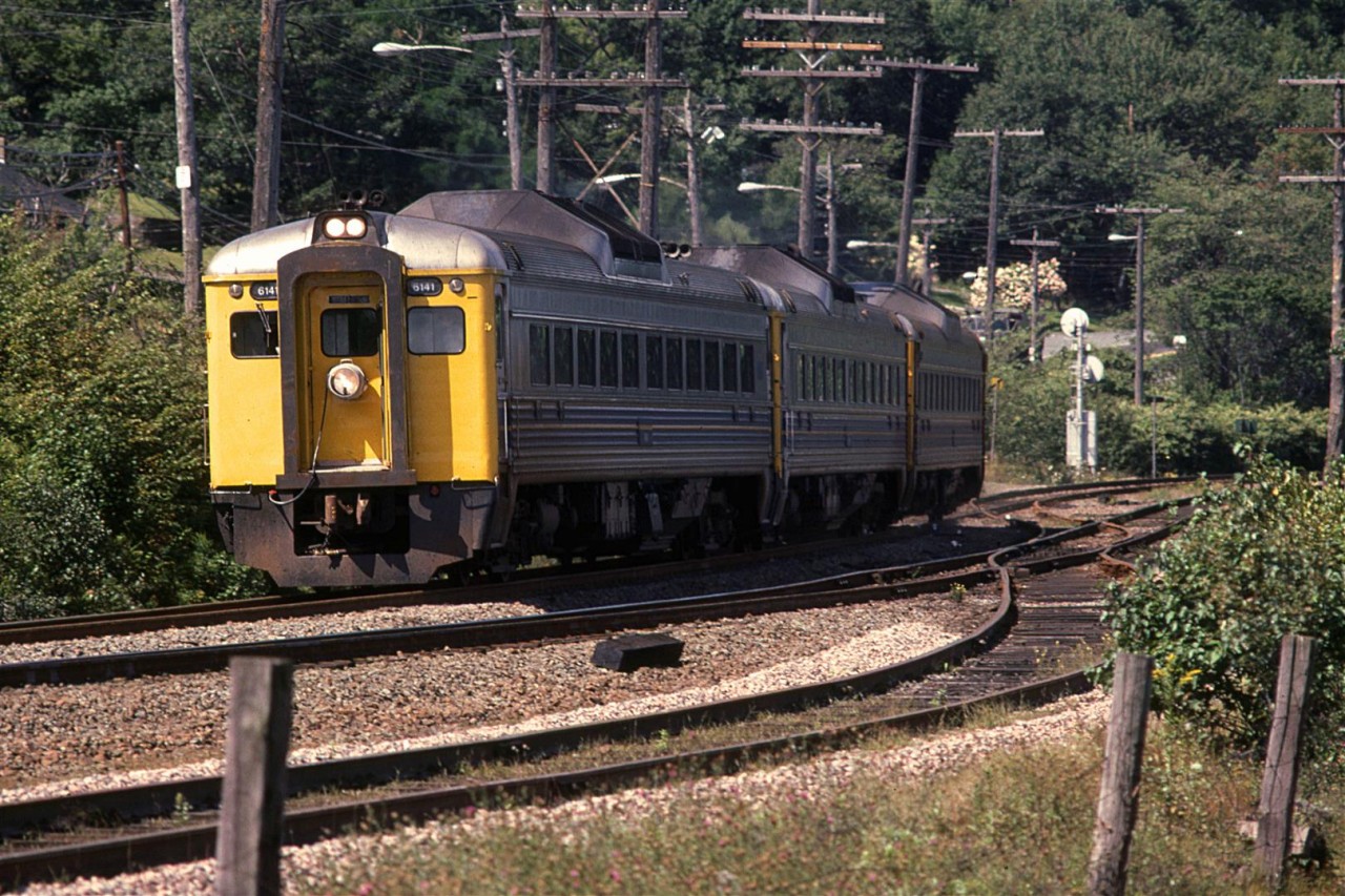 A RDC train zips around Birch Cove, and is now about to round Sherwood Point.